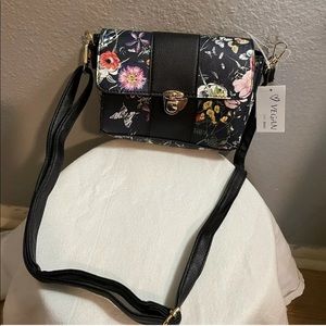 Vegan mini crossbody black floral with adjustable strap.
